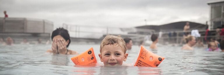 child and mother in the blue lagoon