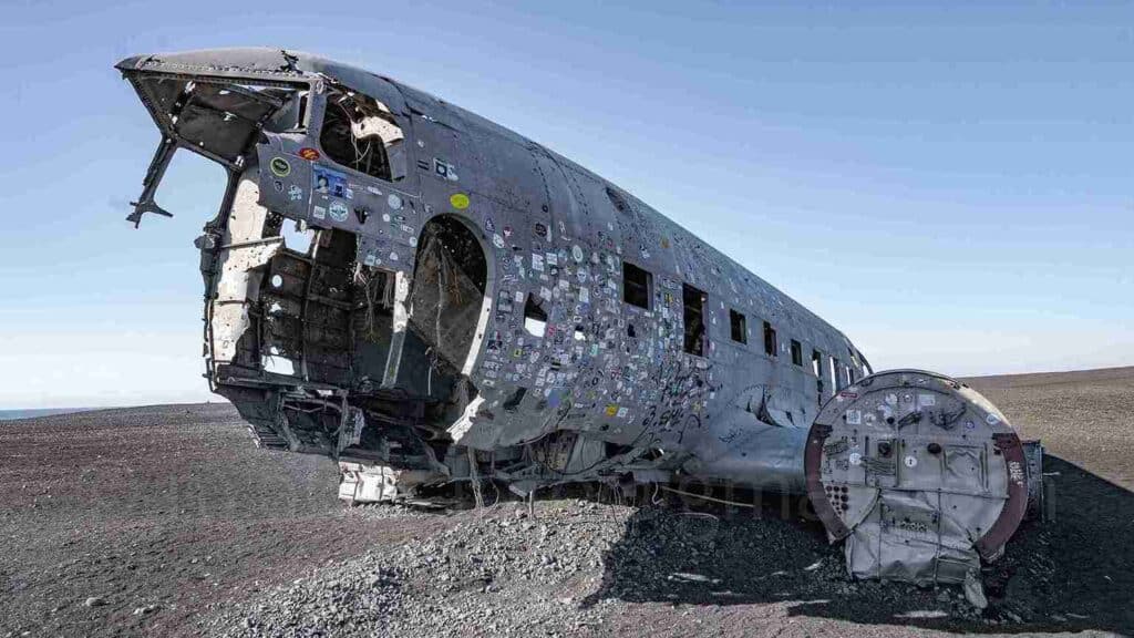 Photo of a famous old plain wreck, in the middle of a sandy dessert.